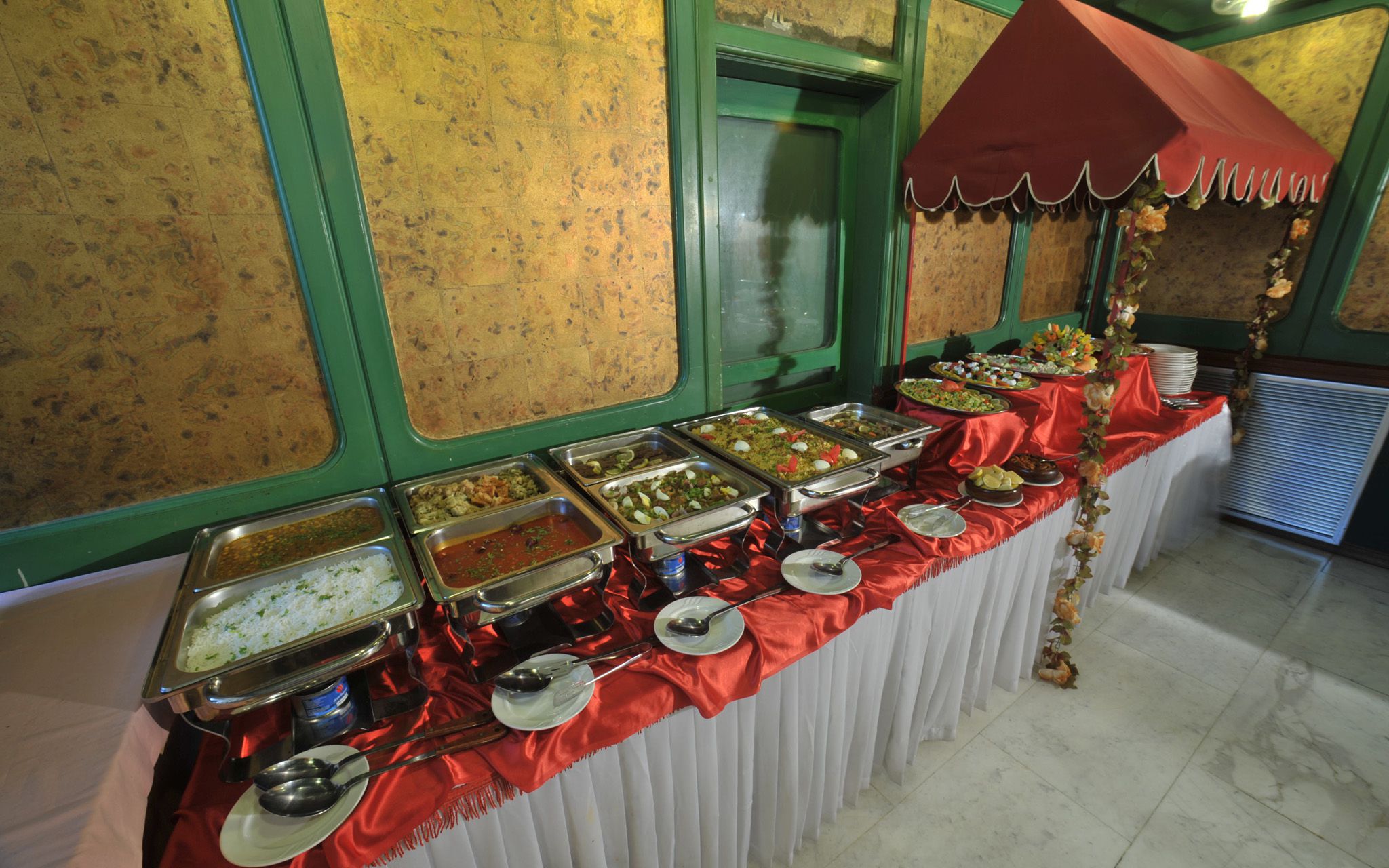 A row of delicious food lined up on a counter in a buffet style